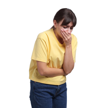Young woman suffering from stomachache and nausea on white background