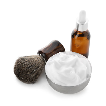 Shaving foam, brush and cosmetic product isolated on white. Barber's toolsの写真素材