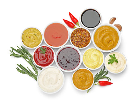 Different sauces and herbs isolated on white, top viewの写真素材