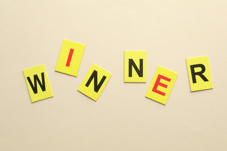 Cards with word Winner on beige background, flat layの写真素材