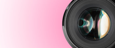 Camera lens on pink gradient background, closeup. Banner design with space for textの写真素材