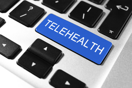 Blue button with word Telehealth on computer keyboard, closeupの写真素材