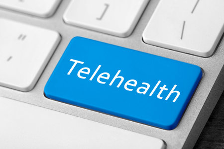 Blue button with word Telehealth on computer keyboard, closeupの写真素材