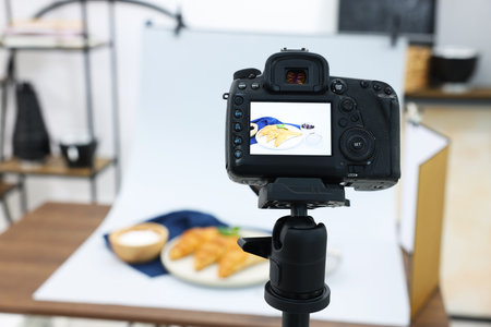 Shooting tasty croissants and ingredients with camera in studio, selective focus. Professional food photographyの写真素材