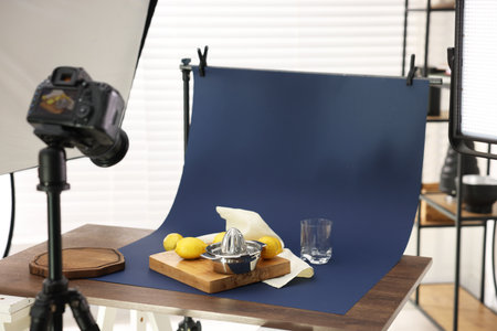 Shooting fresh lemons and juicer with camera in studio. Professional food photographyの写真素材