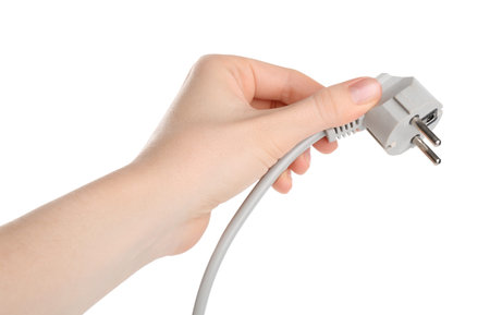 Woman holding plug on white background, closeup
