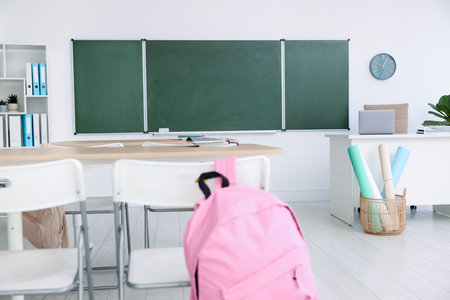 Green chalkboard and stylish furniture in classroom. Mockup for designの写真素材