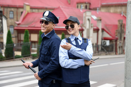 Police officers in uniforms on city street
