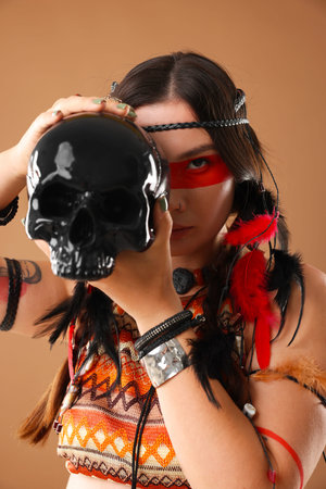 Shaman woman with face painting and skull on pale brown background