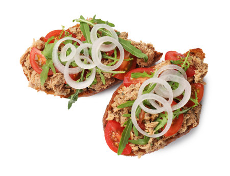 Delicious bruschettas with tuna, tomatoes, onion and arugula isolated on , top viewの写真素材