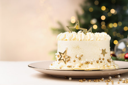 Delicious cake with Christmas decor on white table against blurred lights, closeup. Space for textの写真素材