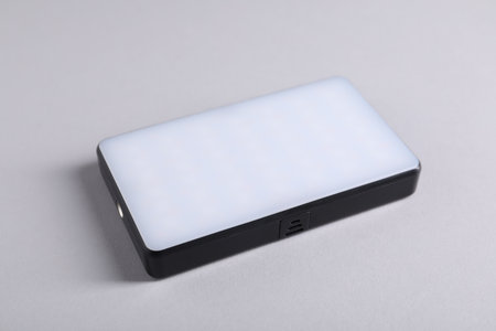 One stylish LED lamp on light gray background, closeupの写真素材