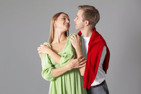 Happy couple hugging on gray background. Romantic dateの写真素材
