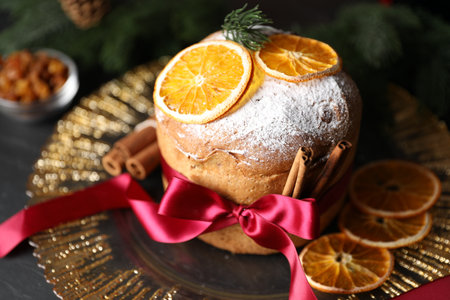 Christmas food. Delicious Panettone cake, ingredients and festive decor on table, closeupの写真素材