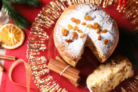 Christmas food. Delicious Panettone cake and festive decor on table, flat layの写真素材