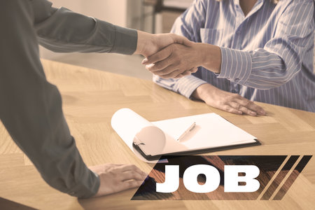 Job search. Recruiter and candidate shaking hands in office, closeupの写真素材