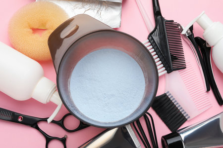 Professional tools and products for hair dyeing on pink background, flat layの写真素材