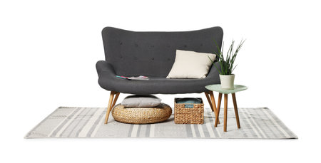 Gray sofa, pillows, side table, storage basket and pouf isolated on whiteの写真素材
