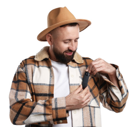Man with hidden camera in his pocket on white backgroundの写真素材