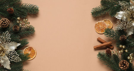 Flat lay composition with fir tree branches, other Christmas decor and spices on beige background, space for textの写真素材