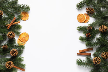 Flat lay composition with fir tree branches, other Christmas decor and spices on white background, space for textの写真素材