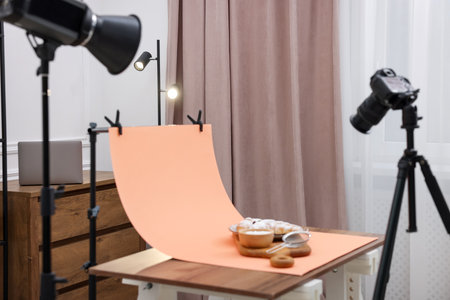 Shooting croissants at table in studio, focus on camera screen. Professional food photographyの写真素材