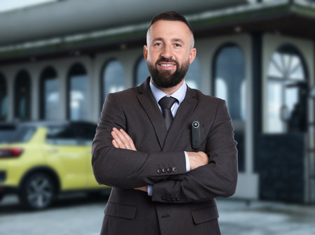 Businessman with camera near building outdoorsの写真素材
