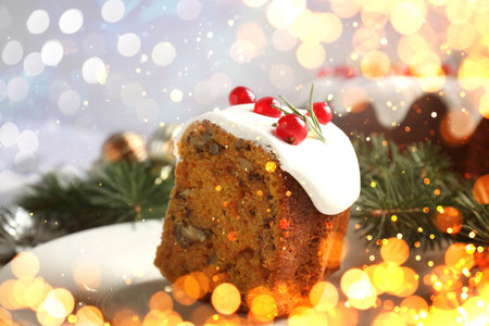 Christmas card with piece of cake and bokeh lights