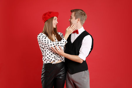 Beautiful couple on red background. Romantic dateの写真素材