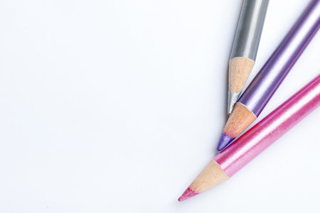 Different pencils on white background, flat lay. Space for textの写真素材