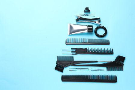 Christmas tree made of hairdresser's tools on light blue background, above view. Space for textの写真素材