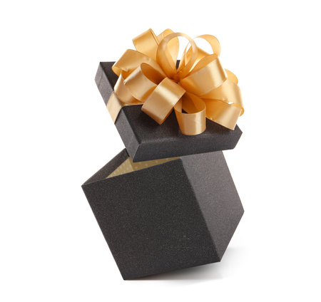Open gift box with beautiful lid in air against white background