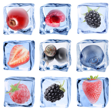Clear ice cubes with berries isolated on white, setの写真素材