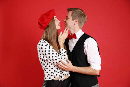 Beautiful couple on red background. Romantic dateの写真素材