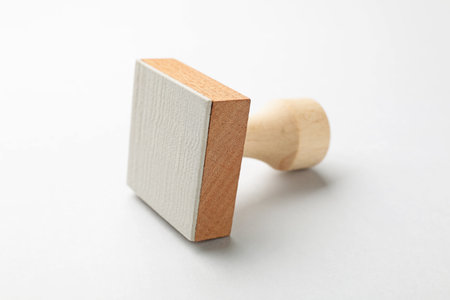 One wooden stamp on white background, closeupの写真素材