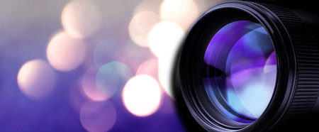 Camera lens against blurred lights, bokeh effect. Banner designの写真素材
