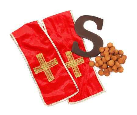 Saint Nicholas (Sinterklaas) day. Red stole, kruidnoten cookies and chocolate letter S isolated on white, top viewの写真素材