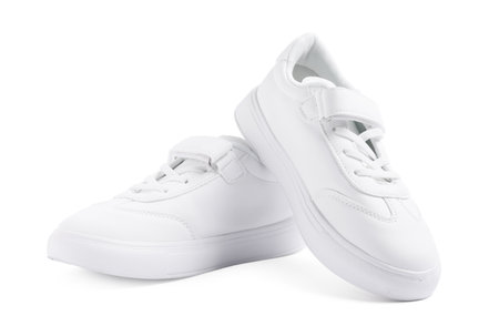 Pair of stylish kid's sneakers isolated on whiteの写真素材