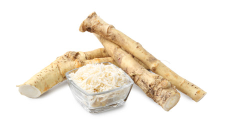 Whole and grated horseradish roots isolated on whiteの写真素材