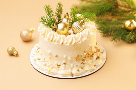 Delicious cake with Christmas decor on beige background, closeup