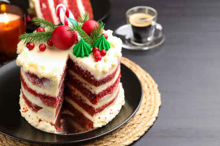 Tasty cake with Christmas decor on black table, closeupの写真素材