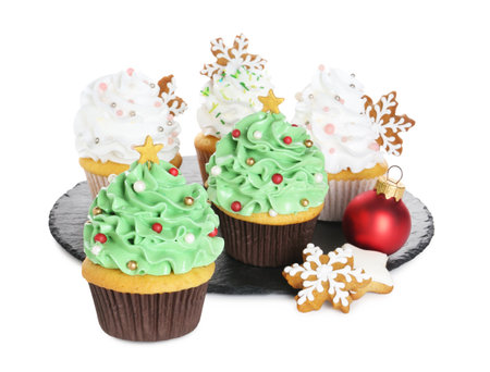 Tasty cupcakes with Christmas decor isolated on whiteの写真素材