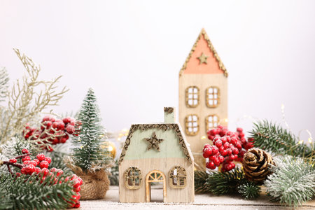 Beautiful Christmas composition with fir tree branches and festive decor on wooden table, closeupの写真素材