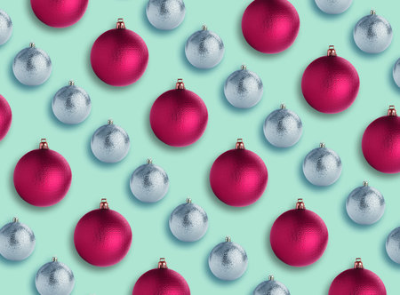 Christmas balls on turquoise background. Pattern design