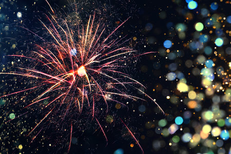Christmas background with fireworks and bokeh lights. Festive wallpaper or greeting card