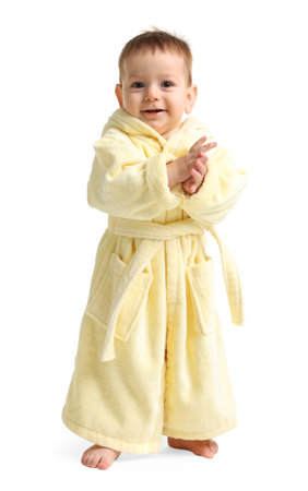 Cute baby in bathrobe on white backgroundの写真素材