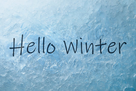 Hello winter card with text on frosty windowの写真素材