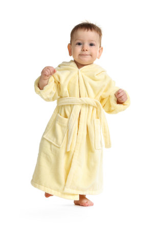 Cute baby in bathrobe on white backgroundの写真素材