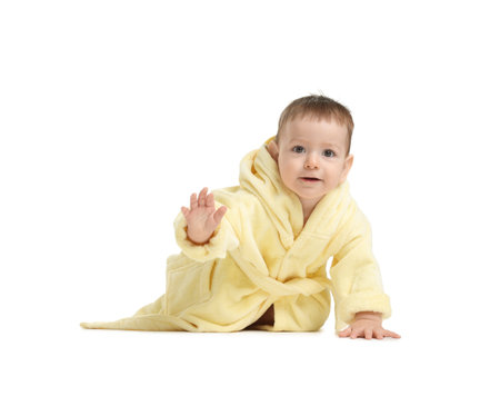 Cute baby in bathrobe on white backgroundの写真素材