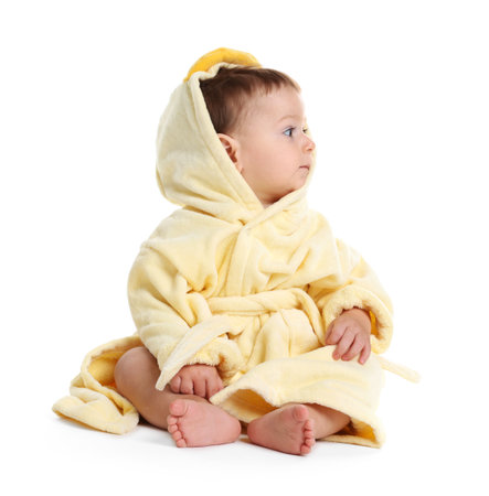 Cute baby in bathrobe on white backgroundの写真素材